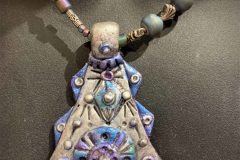 Polymer-with-mica-pendent-with-druzy-and-Tibetian-silver-beads-scaled